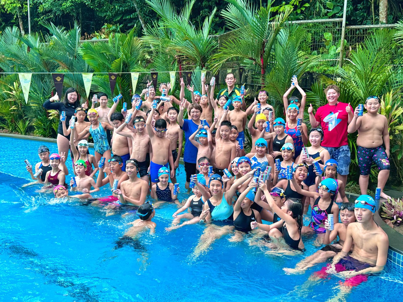 Club swimmers and coaches at the pool