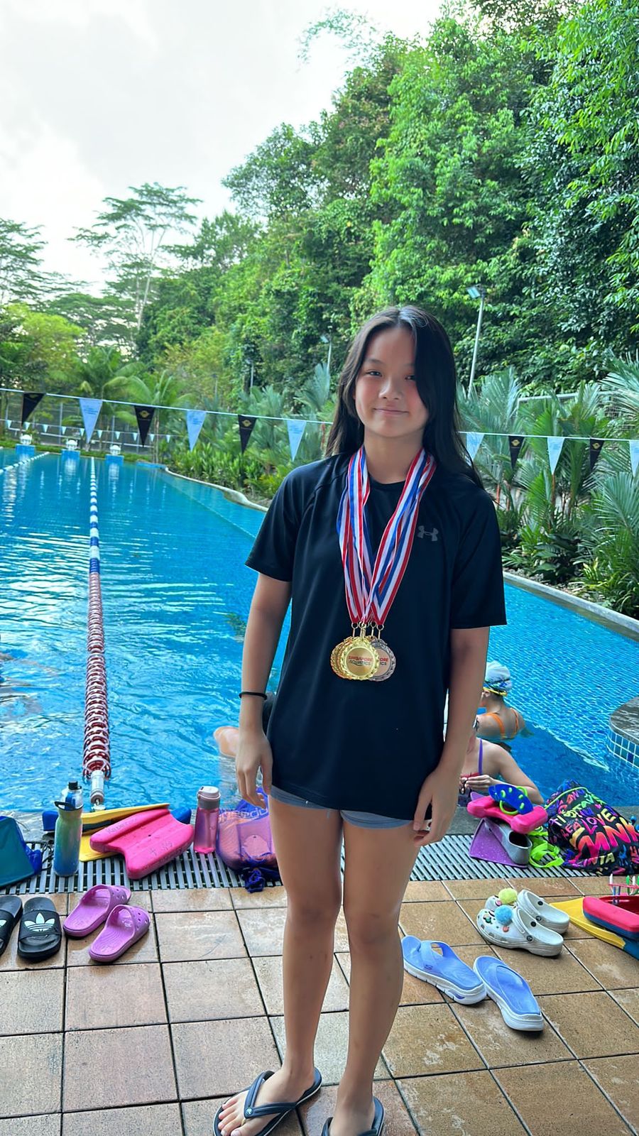 Club swimmer with medals