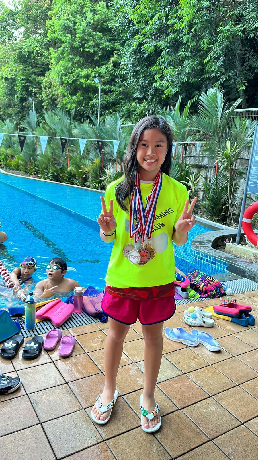 Club swimmer with medals