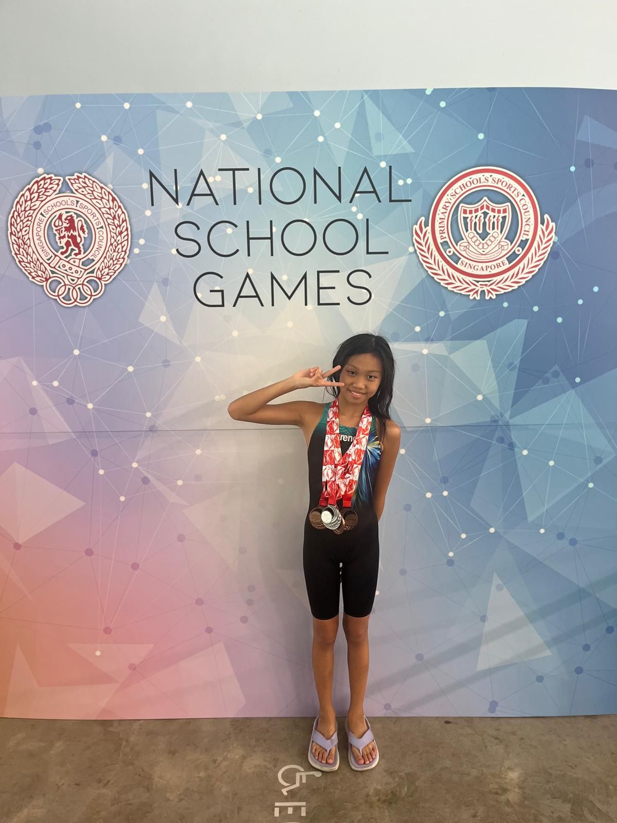 Club swimmer with medals at the National School Games